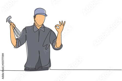 Single one line drawing of carpenter with gesture okay works in his workshop making wooden products. Skills in using carpentry tools. Modern continuous line draw design graphic vector illustration