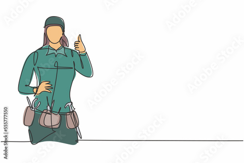 Continuous one line drawing handywoman with thumbs-up gesture is ready to work on repairing the damaged part of the house in a professional manner. Single line draw design vector graphic illustration