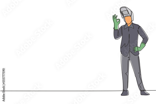 Single one line drawing of welder stands with gesture okay and face shield is removed ready to work in his iron workshop. Success business. Continuous line draw design graphic vector illustration