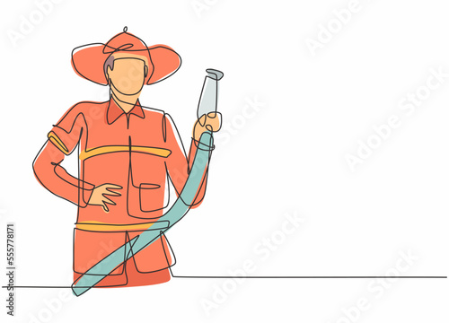 Continuous one line drawing of young male firefighter holding water nozzle. Professional job profession minimalist concept. Single line draw design vector graphic illustration