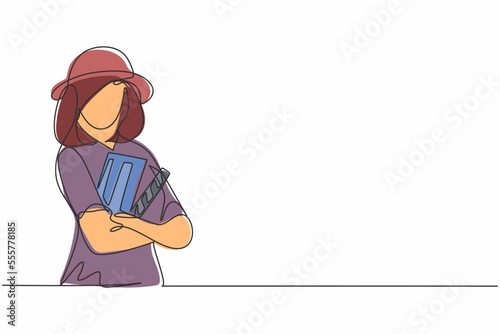 Single continuous line drawing of young female film director cross arms holding clapper board. Professional work job occupation. Minimalism concept one line draw graphic design vector illustration