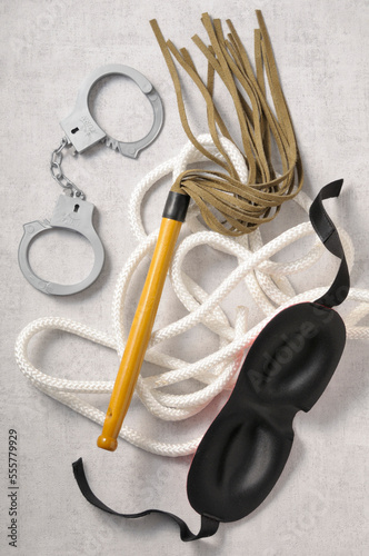 Overhead View of Mask, Handcuffs, Whip and Rope, Studio Shot photo