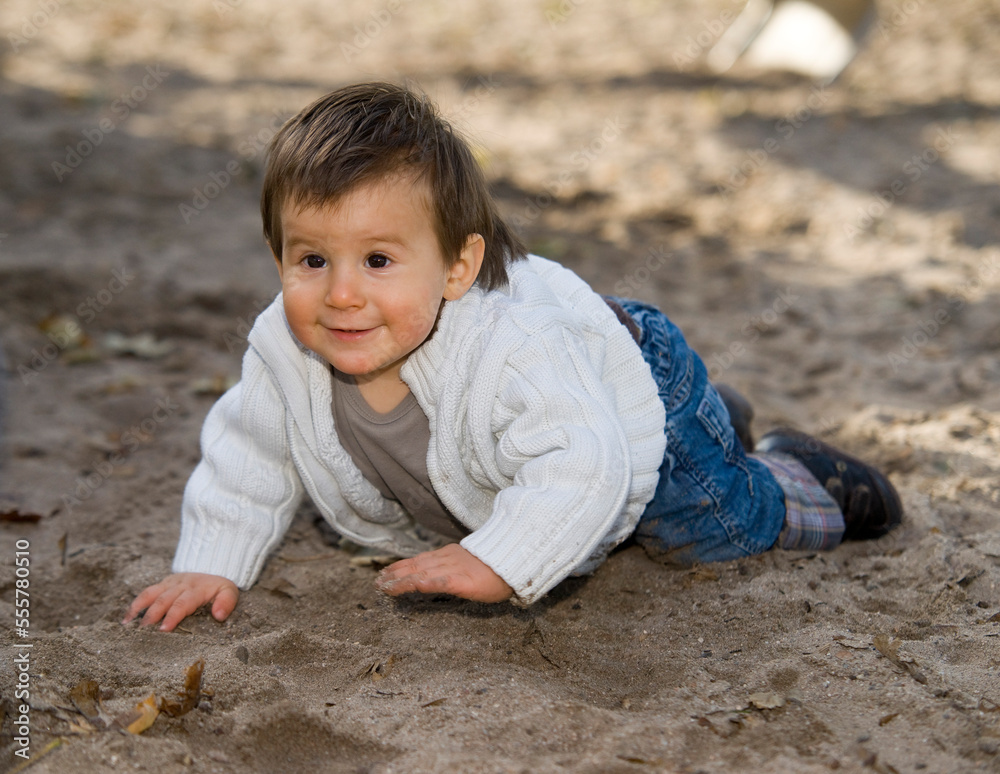 Boy Crawling in Sand