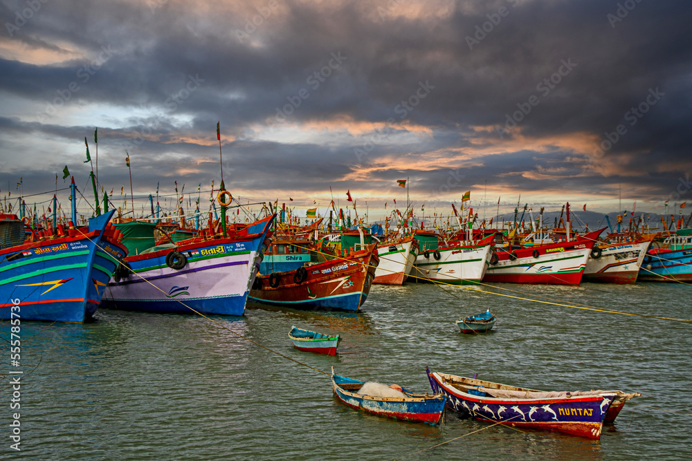 Fishing boats in the harbour on Gujarat coast in India	