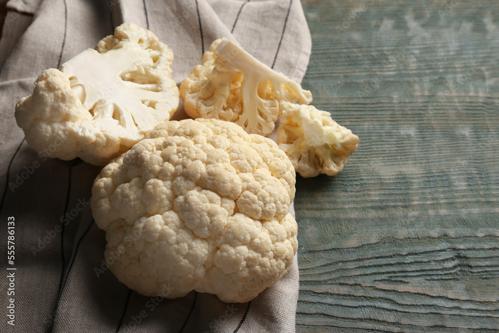 Fresh raw cauliflower on light blue wooden table Fresh raw cauliflower on light blue wooden table