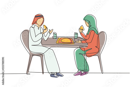 Single one line drawing young Arabian couple husband and wife having cake meal around table. Celebrate wedding anniversary with romantic dinner. Continuous line draw design graphic vector illustration