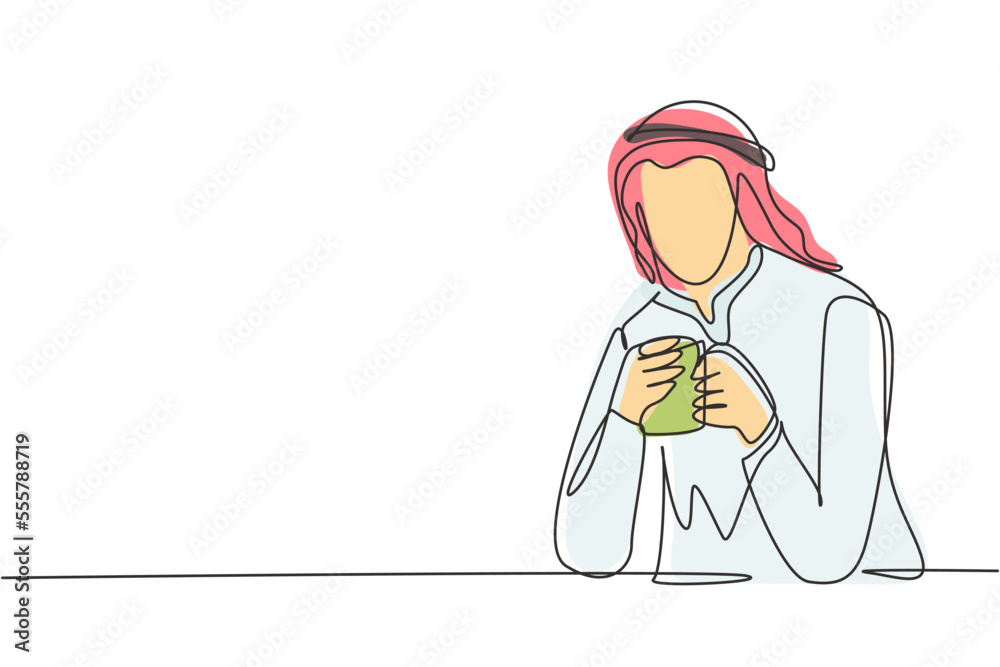 Single continuous line drawing young Arabian man sitting and holding a cup of coffee in one hand. Enjoy morning before work at office. Success person. One line draw graphic design vector illustration