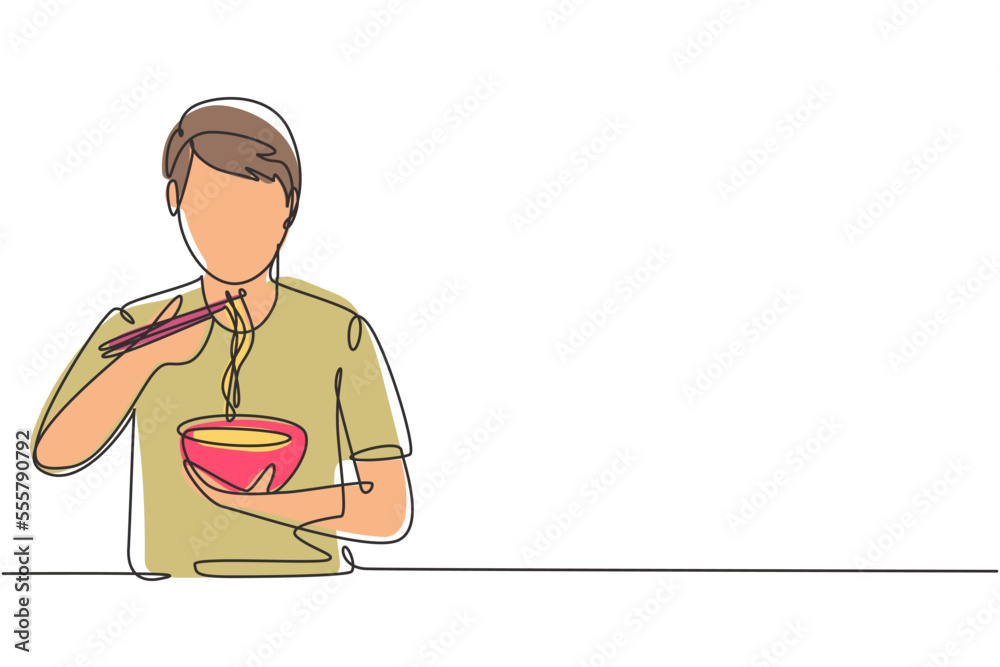 Single one line drawing young male having noodles meal with chopsticks around table. Enjoy lunch when hungry. Delicious and healthy food. Modern continuous line draw design graphic vector illustration