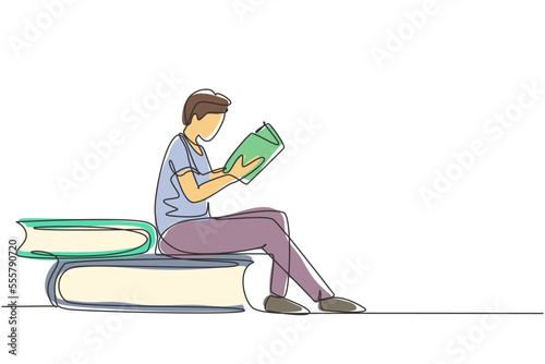 Continuous one line drawing young man reading, learning and sitting on big books. Study in library. Literature fans or lovers, education concept. Single line draw design vector graphic illustration