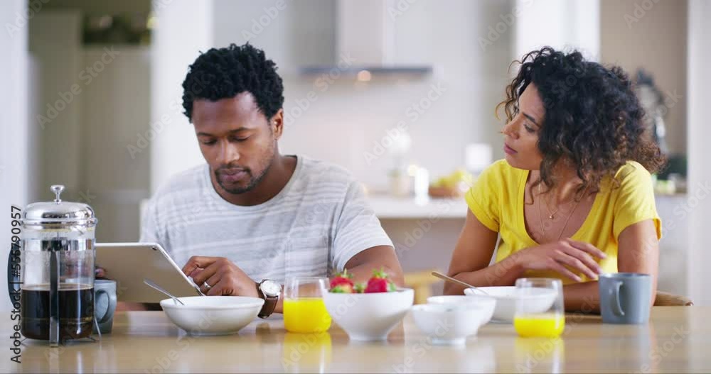 Morning, couple and tablet to ignore fight with partner at breakfast table after argument. Interracial, marriage and frustrated woman asking for attention from rude husband on social media. Morning, couple and tablet to ignore fight with partner at breakfast table after argument. Interracial, marriage and frustrated woman asking for attention from rude husband on social media.