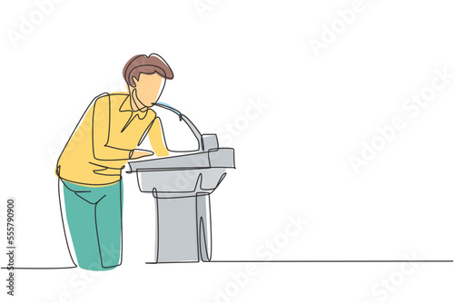 Continuous one line drawing a young man who is thirsty drinking at ready-to-drink taps that are widely available in public spaces. Refresh moment. Single line draw design vector graphic illustration