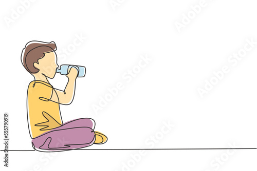 Single one line drawing boy sitting while enjoying a bottle of fresh milk to fulfill his body nutrition. Child health and growth concept. Modern continuous line draw design graphic vector illustration