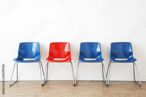 Row of Red and Blue Chairs in Waiting Room
