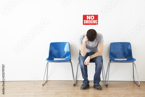 Man Sitting in Waiting Room