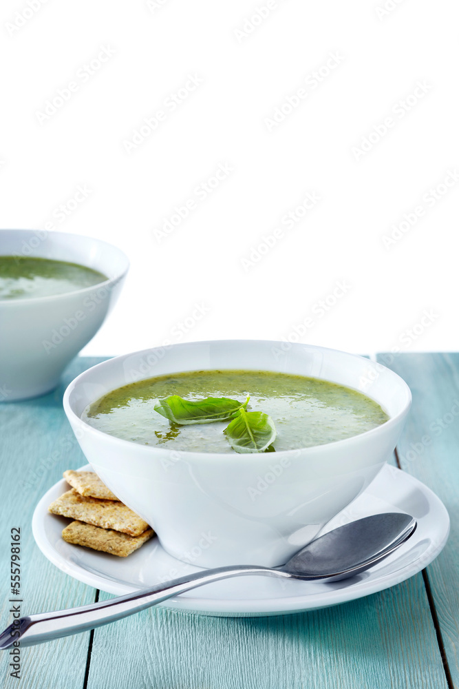 Green Soup with Basil Garnish and Crackers, Studio Shot Green Soup with Basil Garnish and Crackers, Studio Shot
