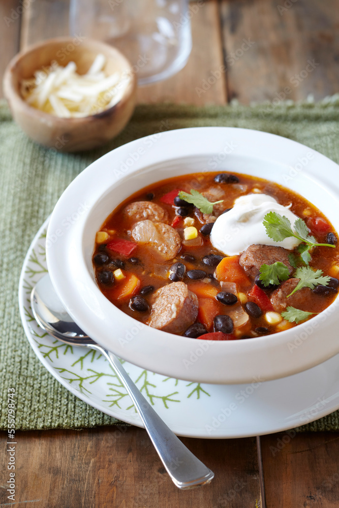 Black bean and sausage soup topped with sour cream Black bean and sausage soup topped with sour cream