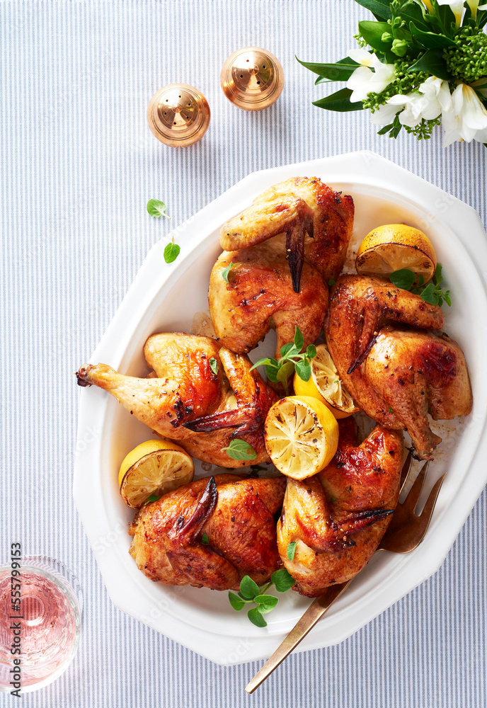 Platter of roasted cornish hens with lemon and herbs Platter of roasted cornish hens with lemon and herbs