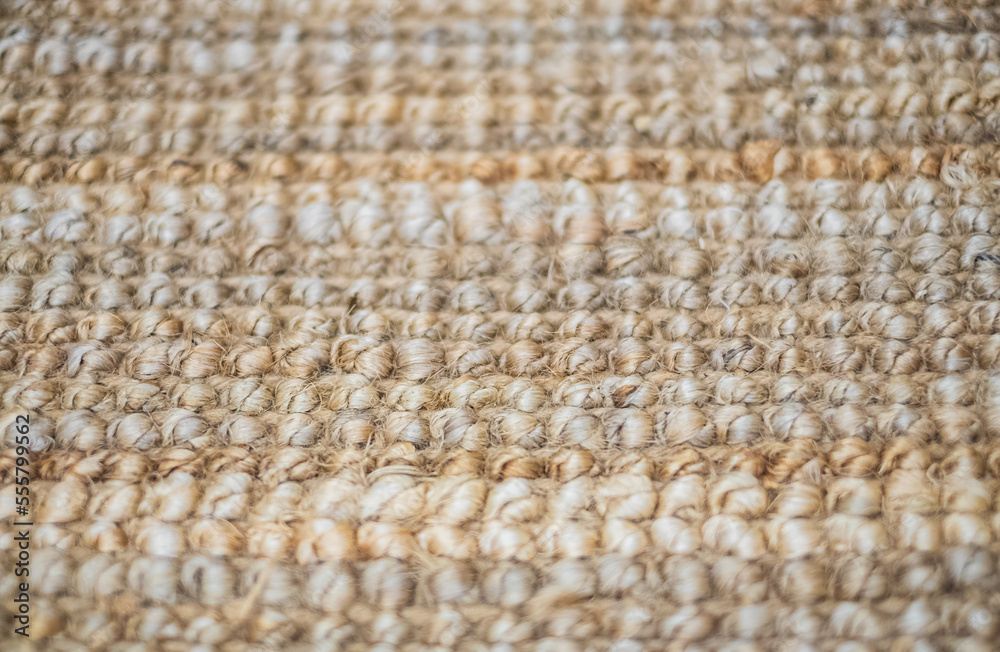 Fototapeta premium Natural linen texture for the background. Handmade rug made of jute. Jute knitted fabric