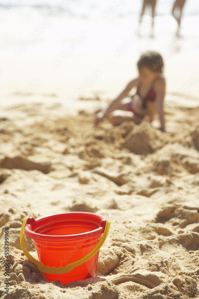 Bucket on Beach, Little Girl Playing in the Sand Bucket on Beach, Little Girl Playing in the Sand