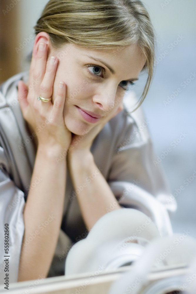 Portrait of Woman Looking in Mirror Portrait of Woman Looking in Mirror