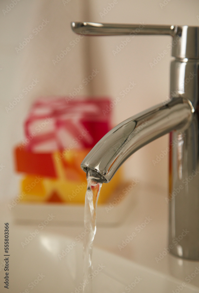 Close-up of Running Water from Bathroom Faucet Close-up of Running Water from Bathroom Faucet