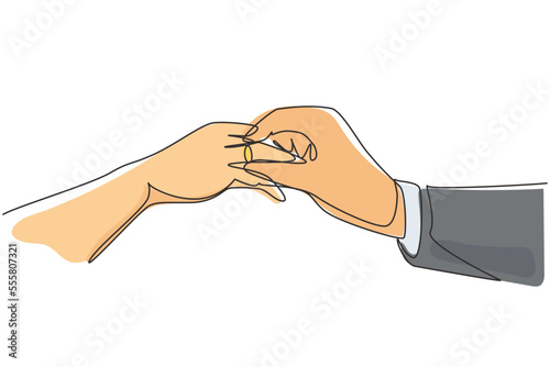 Continuous one line drawing groom putting ring on bride's finger during wedding ceremony. Bride and groom make vow of loyalty on their wedding day. Single line draw design vector graphic illustration