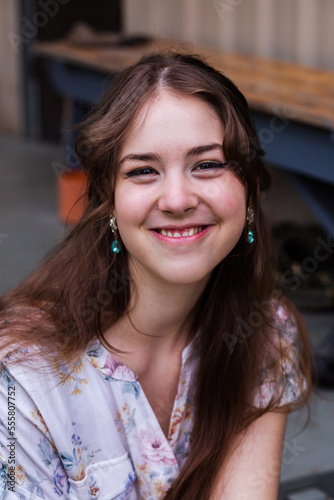 Smiling portrait headshot of happy eighteen year old woman photo