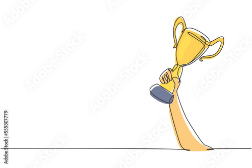Single continuous line drawing gold trophy held by one hand. Symbol of winning championships, matches and sports competitions. Best achievement ever. One line draw graphic design vector illustration