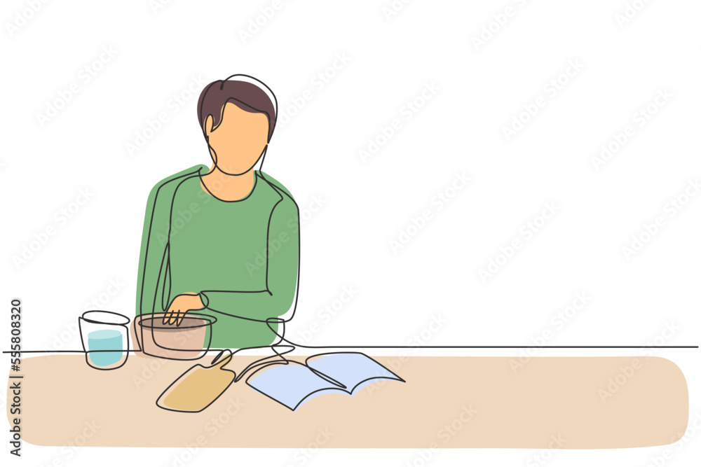 Single continuous line drawing handsome male cooking meal while reading tutorial book on cozy kitchen table at home. Healthy food lifestyle. Dynamic one line draw graphic design vector illustration
