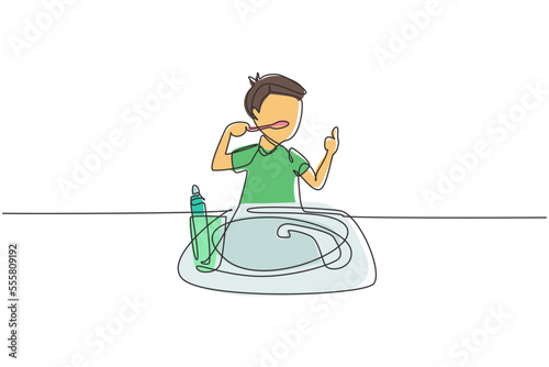 Single continuous line drawing boy brushing his teeth with thumbs up gesture. Routine habits for cleanliness, health, freshness of mouth and teeth. One line draw graphic design vector illustration