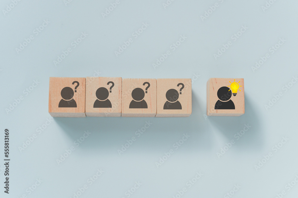 Problem solving, creative idea or innovative idea, outstanding person concept. outstanding wooden blocks with brighten lightbulb icon with blurred others and question mark Problem solving, creative idea or innovative idea, outstanding person concept. outstanding wooden blocks with brighten lightbulb icon with blurred others and question mark