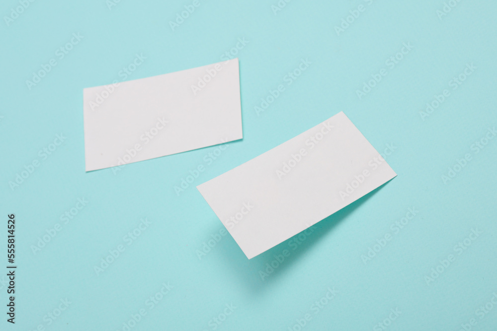 White Blank business card for corporate identity on blue background. Creative mockup.