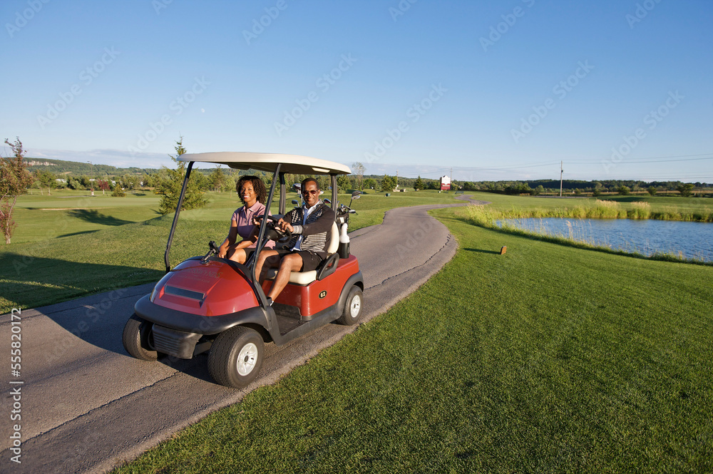 Couple in Golf Cart, Burlington, Ontario, Canada