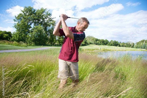 Man Golfing in Tall Grass
