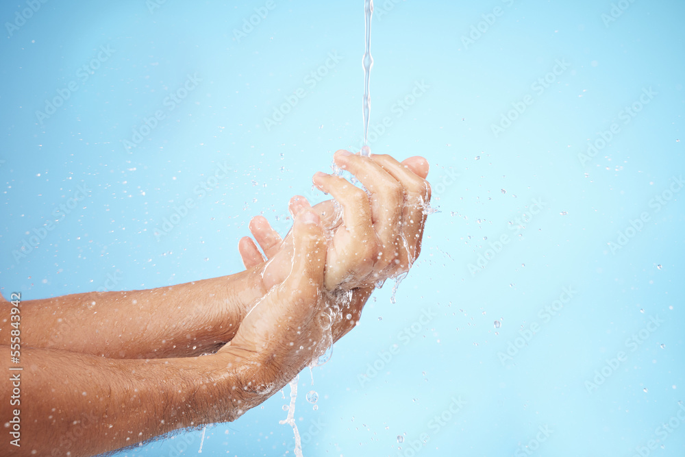 Fototapeta premium Man, water or washing hands on blue background for body hygiene maintenance, healthcare wellness or skincare grooming routine. Model, water splash or running shower for cleaning bacteria or self care