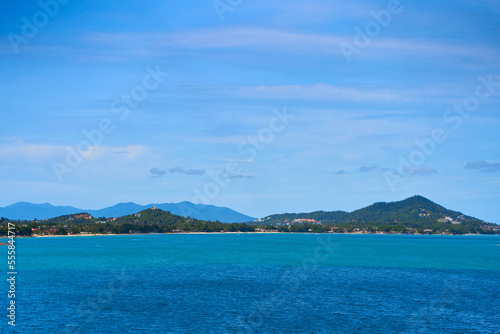 A seascape with turquoise water and islands in the distance. Winter vacation in Thailand