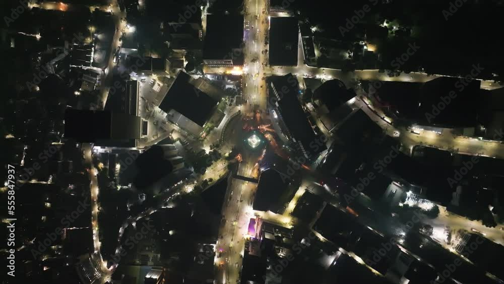 Aerial view of vehicles driving a roundabout with a circle fountain in Dhaka downtown, Bangladesh.