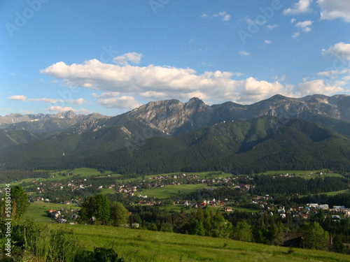 Beautiful panorama of the Polish Tatra Mountains and the city of Zakopane from the top of the Gubalowka mountain on a sunny summer day, Zakopane, Poland.