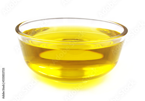 Close up of glass bowl with cooking oil isolated on white background.