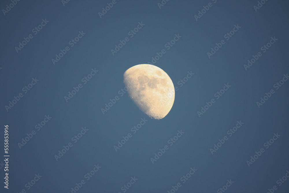 The moon against the blue, cloudless, summer sky, Lodz, Poland. The moon against the blue, cloudless, summer sky, Lodz, Poland.