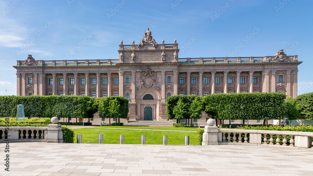 Fototapeta premium Facade of Riksdagshuset, the Swedish Parliament House, located on the island of Helgeandsholmen, Old town, or Gamla Stan, Stockholm, Sweden, in a summer day