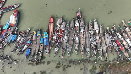 Aerial view of people along the port waiting for passengers boats at the Third largest Muslims congregation in Barisal, Bangladesh. photo