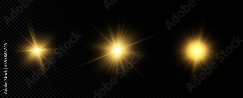 Golden particles of light. Golden light. Light flare.Stars isolated on transparent background.