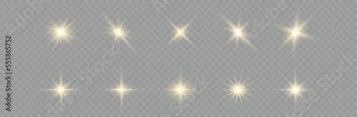 Golden particles of light. Golden light. Light flare.Stars isolated on transparent background.