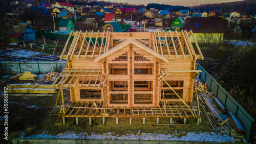 wooden house under construction made of timber photo