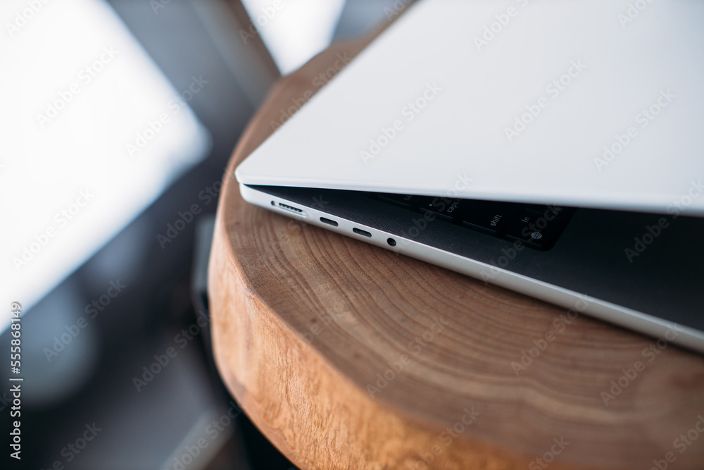 magsafe 3. Macbook pro 14 2022. magnetic charger charges laptop on background. USB-C to MagSafe 3 Cable magsafe 3. Macbook pro 14 2022. magnetic charger charges laptop on background. USB-C to MagSafe 3 Cable