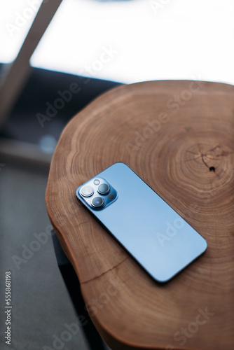 smartphone with three cameras on the table