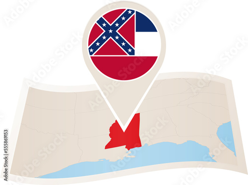 Folded paper map of Mississippi U.S. State with flag pin of Mississippi. photo