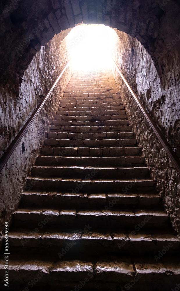 a staircase ascending to the light