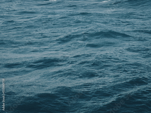 Close-up of dark waves of deep blue sea